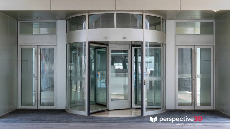 Revolving glass door at a contemporary office entrance, showcasing modern architecture and professio.